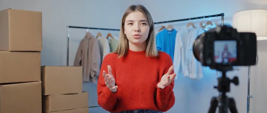 Content Creator's Corner: A vibrant young woman shares her expertise, engaging her audience with passion and confidence, against a backdrop of modern simplicity, offering insights and inspiration.