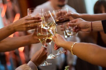 Hands Raising Glasses at Party Celebration
