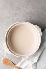 Instant dry yeast sprinkled on warm water, dry yeast granules on water