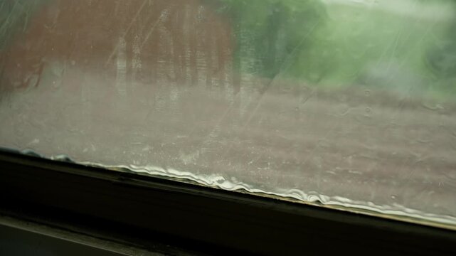 Heavy Rain on Car Windshield During Thunderstorm