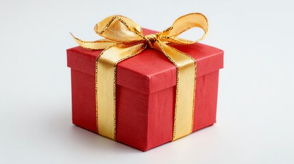 Obraz premium A red gift box with a gold bow, a Christmas present.