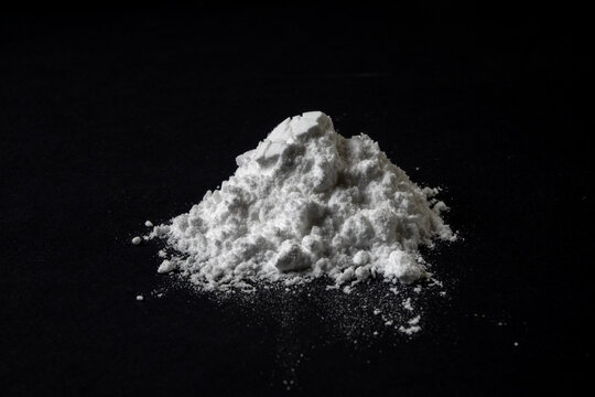 Creatine Powder Pile on Black
