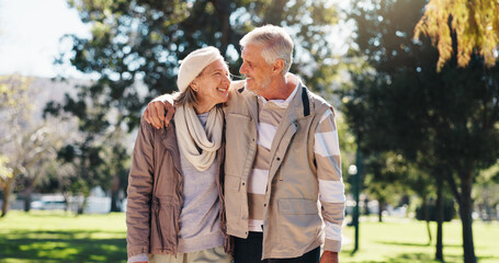 Retirement, walking and couple in nature with hug, love and bonding together in happy marriage. Romance, old man or woman in park with embrace, connection or outdoor stroll in healthy relationship.