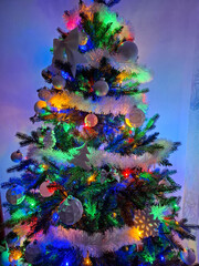 Colorful lights lit on a Christmas tree