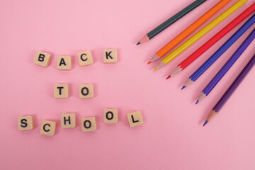 Vibrant Colored Pencils and Letter Tiles Spell Out Back to School