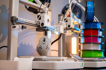 A student man print prototype on 3D printer