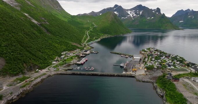 Aerial View Of Husoy, Small Fishing Village On An Islet Off The Coast Of Senja Island In Northern Norway.