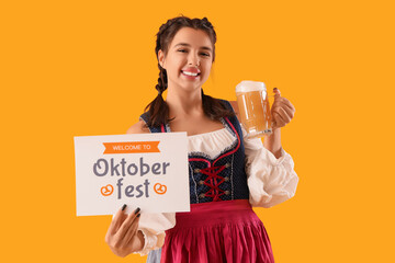 Young Octoberfest waitress with beer and greeting card on yellow background