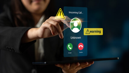 A business professional interacts with a digital tablet showing an incoming call from an unknown contact, accompanied by warning notifications, illustrating modern communication concerns. Gantry