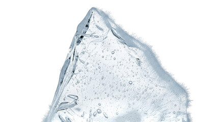 Clear ice shard with air bubbles and frosty edges on black frozen cold