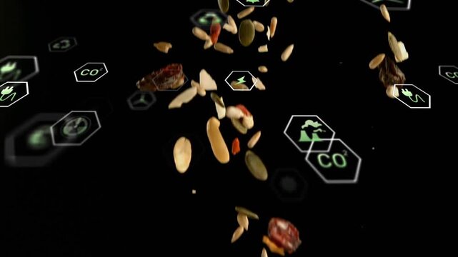 Top-edge release sending falling seed and nut bits rotating through green hex icons showing impact