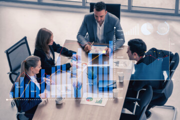 A diverse business team engages in a collaborative discussion in a modern office setting, utilizing financial reports and data visualization to enhance decision-making. Scalp