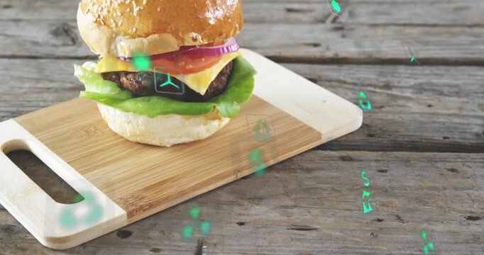 Green holograms appearing layers stacking camera centering showing cheeseburger on bamboo board