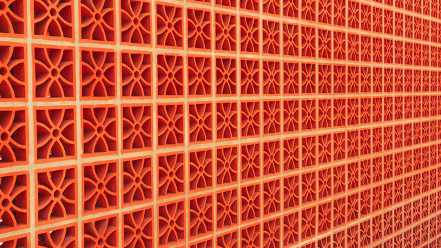 Vibrant Orange Breeze Block Wall Texture for Retro Mid-Century Design Backdrop