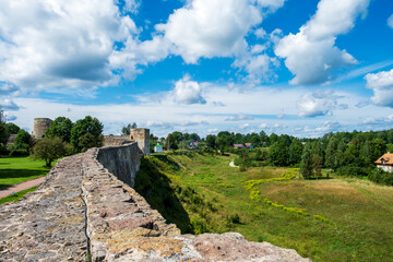 Izborsk, Russia - August 6, 2025. Ancient Stone Fortress Overlooking Scenic Countryside