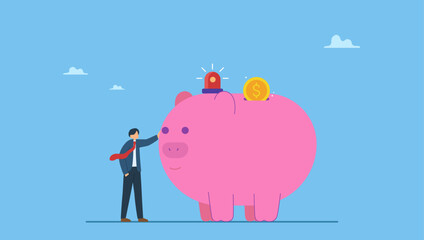 Smart businessman standing with piggy bank with emergency siren light. Emergency funds prepared to pay for unexpected situation in life, loss a job, economic crisis causing income cut or accident.