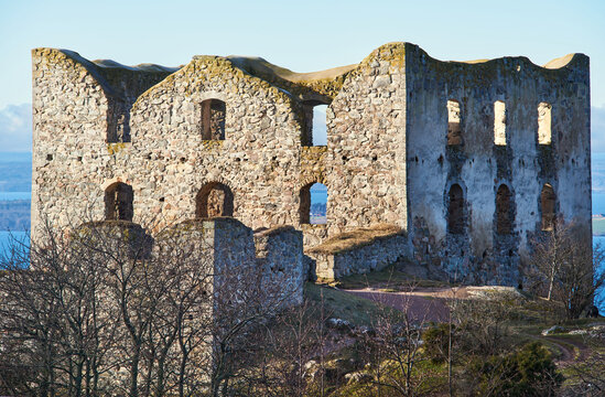 Brahehus slottsruin (castle ruin) above Lake V&auml;ttern or Vattern near Uppgr&auml;nna, Sweden, evokes Swedish medieval history, Nordic heritage and scenic Scandinavian travel or vacation on a crisp sunny day