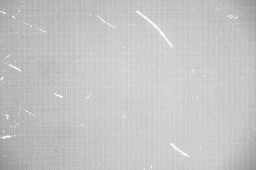 Seamless vintage distressed small halftone dot background pattern. Grunge black and white printer ink raster dots transparent texture overlay.