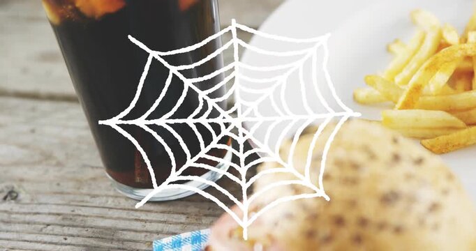 Napkin and burger moving forward after placement, cola staying left, spiderweb centering focus