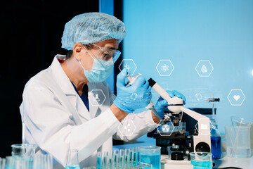 Scientist working with a microscope in a high-tech lab, showcasing biotech, medical research, and futuristic innovation.
