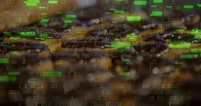Chocolate pastries staying static while green binary code fading in then rising, showing data