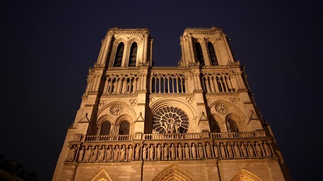 Notre dame de paris cathedral majestic facade at night