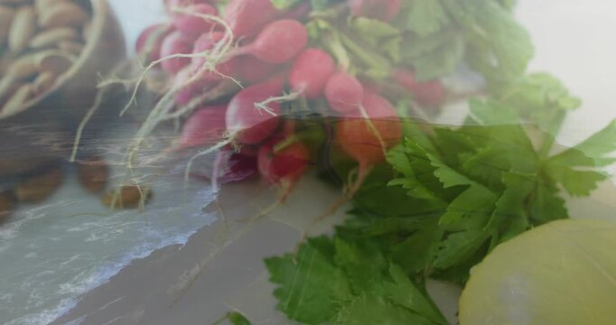Ocean wave overlay starting left, moving across produce, revealing radishes and lemon for styling