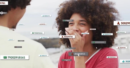 Woman laughing, covering mouth at pier reacting to floating social UI showing ring as man gesturing - Powered by Adobe