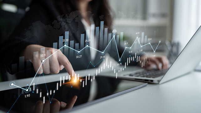 A professional woman analyzes financial data on her laptop, showcasing stock market graphs and trends. The scene captures modern business insights and investment strategies. Scalp - Powered by Adobe