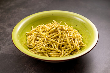 Italian trofie pasta with pesto creating a traditional dish