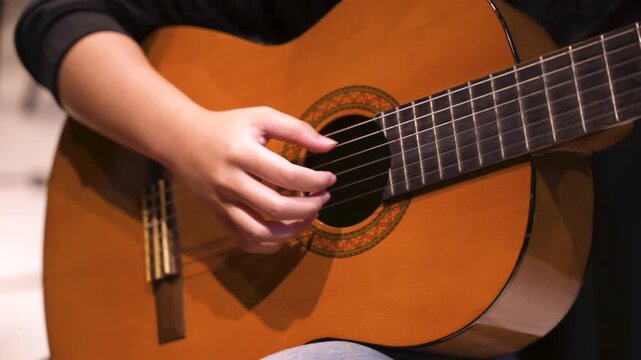 Close-Up of Hand Playing Classical Guitar Chord
