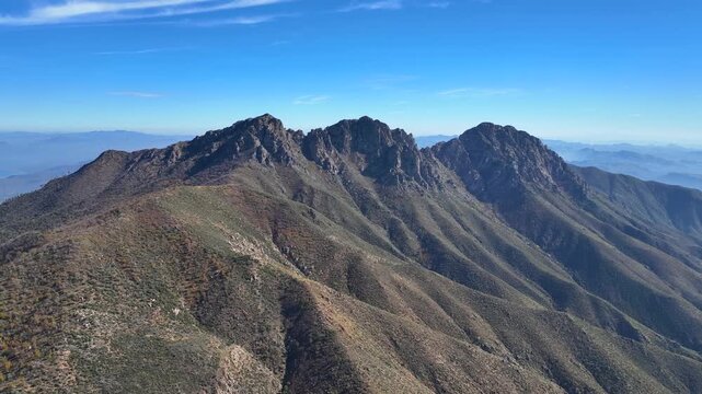 Aerial view of the rugged Four Peaks Wilderness, with its dramatic peaks and ridges under a clear sky, Apache Junction, Arizona, United States.