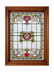 Ornate wood framed stained glass window featuring love hearts isolated