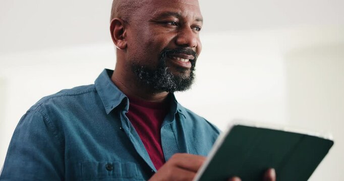 Below, creative and black man reading with tablet for research, proofreading and update draft. Mature person, digital and thinking for editor feedback, story submission and information on publication
