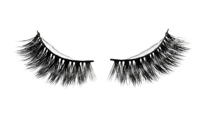 Pair of dramatic false eyelashes with wispy strands on black background artificial lashes