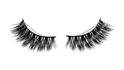 Pair of dramatic false eyelashes with wispy strands on black background artificial lashes