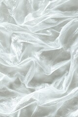 Obraz premium Delicate white fabric drapes in soft folds creating ethereal texture