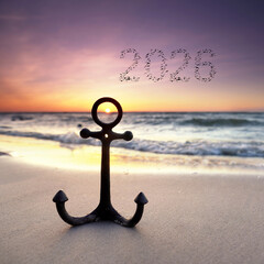 iron anchor at the beach with flying birds in shape of 2026