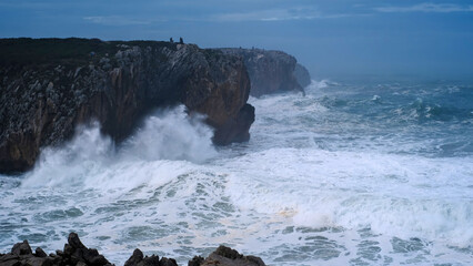 Dramatic view of huge waves crashing against the limestone cliffs at Bufones de Pria, Asturias, Spain