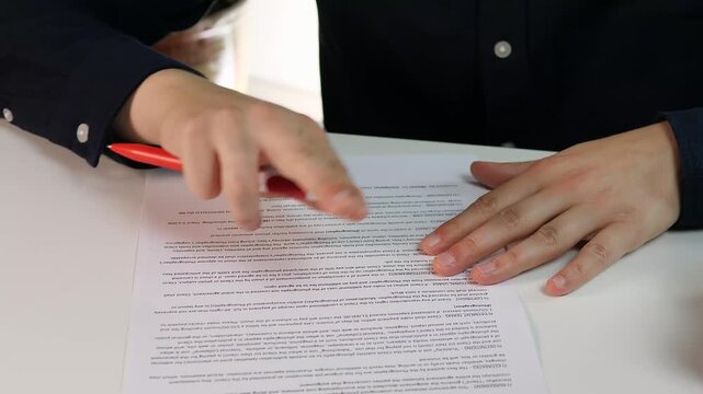 Dynamic hands of a businessman actively explaining and highlighting details on a contract. This clip represents collaboration, clarification, signing a deal, and successful communication. 