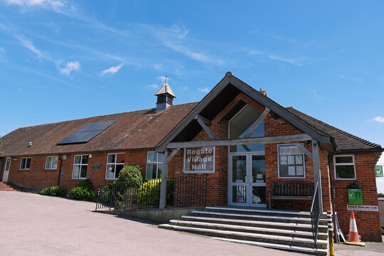 Rogate, West Sussex, England. 27th June 2025. Traditional Brick Rogate Village Hall with Wooden Porch and Steps on Sunny Day