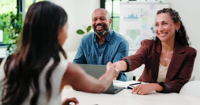 Happy, people and handshake in office with meeting for marketing agreement, statistics and data analysis. Creative, team and shaking hands in workplace with advertising approval, b2b deal and graphs.