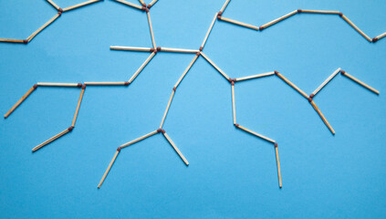 Global network connection made by match on the blue background.