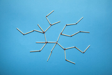 Global network connection made by match on the blue background.