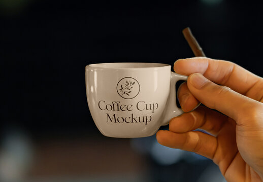 Small Porcelain Cup in Hand Mockup