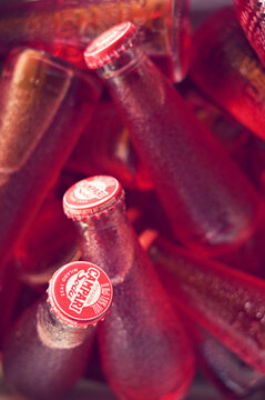 Multiple Campari Soda Bottles Filling the Frame in Bright Arrangement