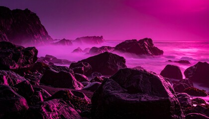 Colorful sunset lights up rocky shoreline and ocean waves in a coastal scene near a beach