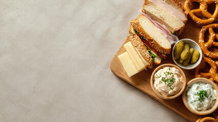 Charcuterie Board with Sandwiches, Pretzels, and Dips
