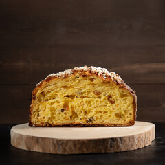 Panettone Traditional Italian cake for Christmas on rustic wooden table. Copy space