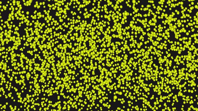 Abstract pattern of scattered yellow dots on black background